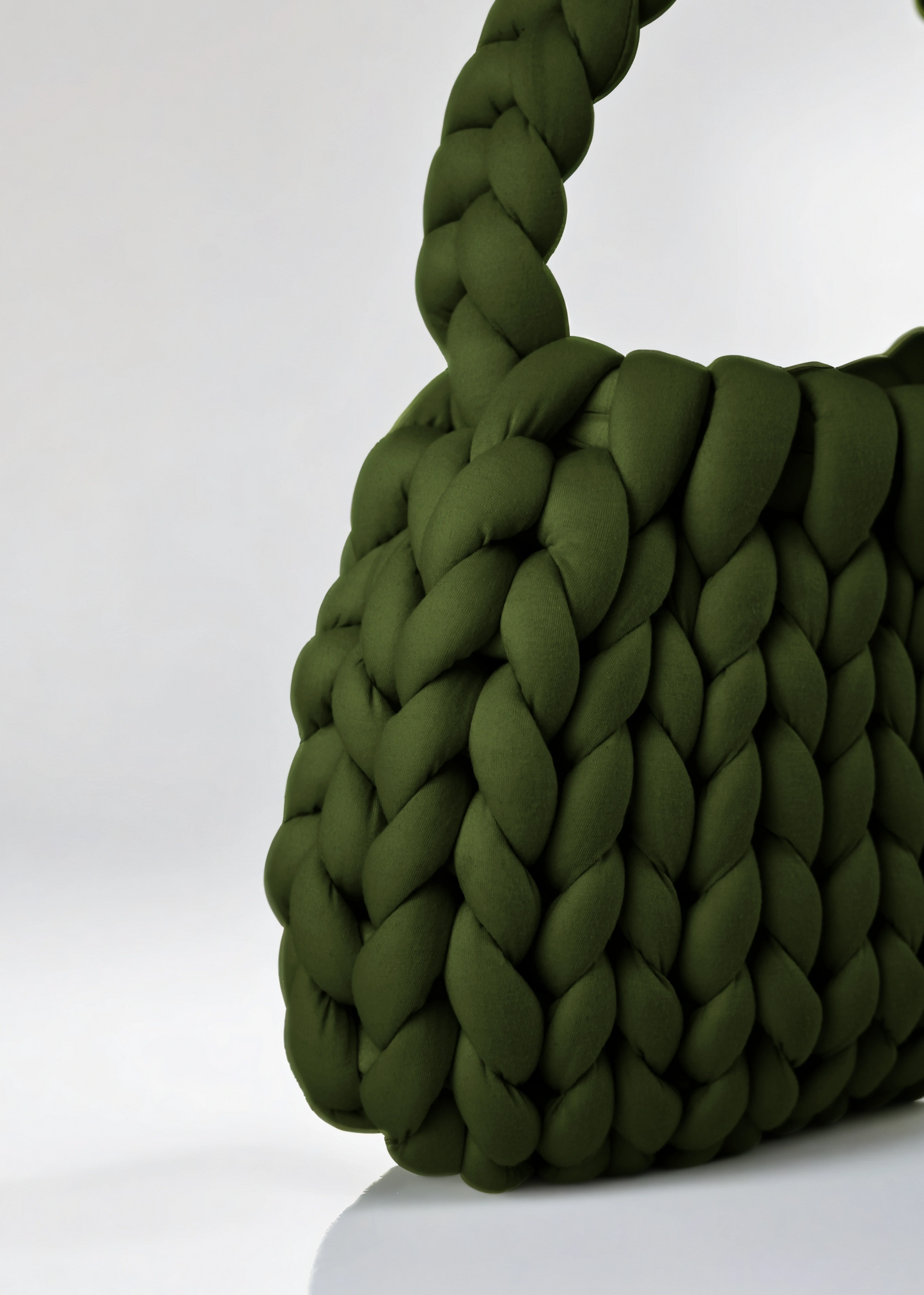 Green color Chunky crescent shaped bag closed up