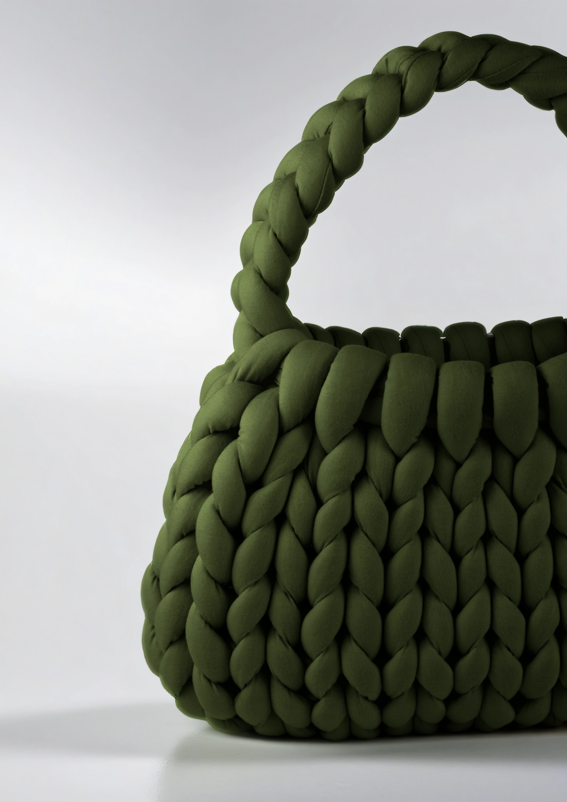 Green color Chunky crescent shaped bag closed up half bag